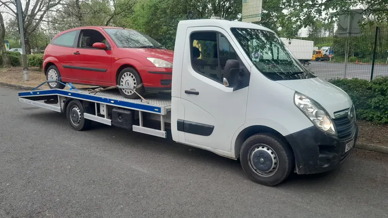 Scrap car bought and loaded onto a recovery truck in Penrith